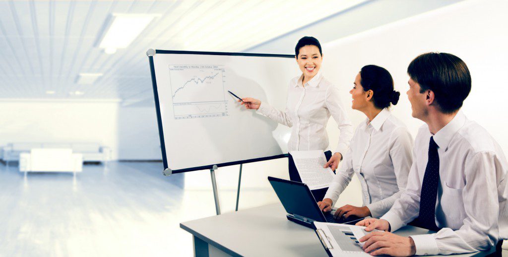 Business Meeting around Sales Graph Progress