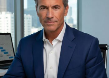 A confident mid-50s CEO in a navy suit sits at a modern executive desk in a bright corner office, leaning forward with a focused, slightly skeptical expression as he looks directly at the viewer. On the desk are a laptop displaying sales pipeline charts and a notepad with handwritten notes including “Why 72% miss quota?”, creating a professional and thought-provoking business scene.